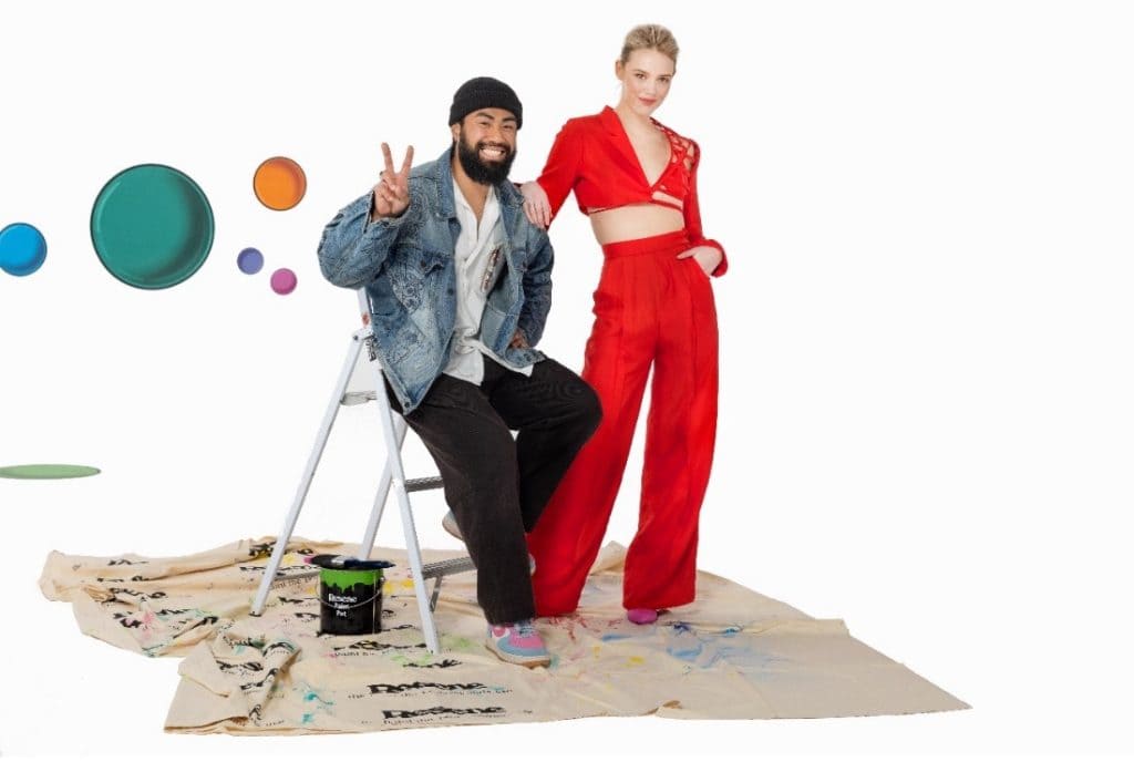 Jordan Tay with his red Resene Colour of Fashion 2021 winning design.